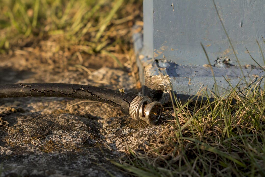 Damaged CCTV cable showing wear and corrosion