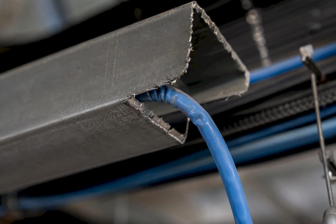 Cat6 cable bent sharply over conduit lip